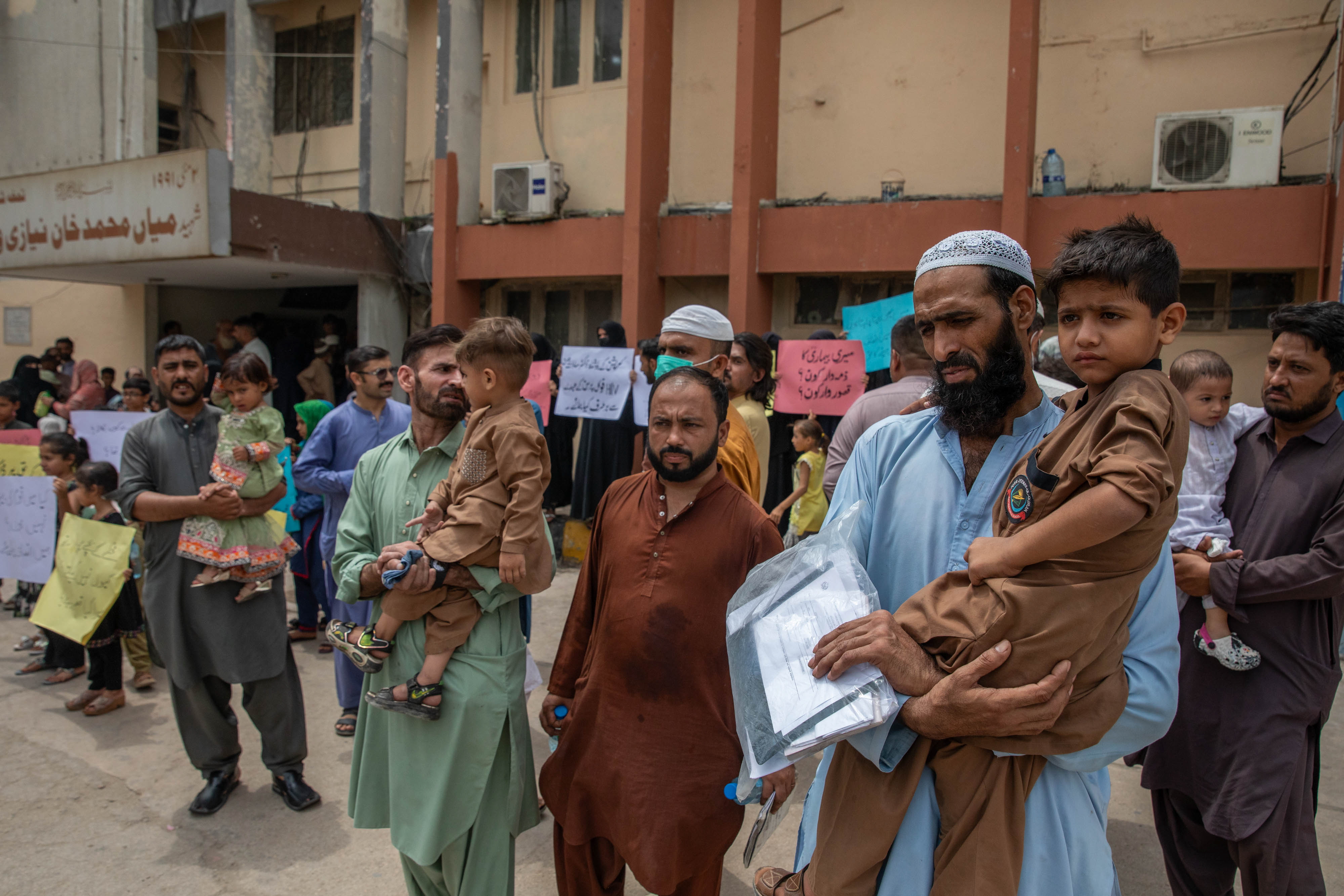 Parents of children who tested positive for HIV after receiving care at Kulsum Bai Valika Hospital in Karachi, Pakistan, held a protest there on July 23. These families received care at Valika Hospital through an aid program run by the labor ministry. Many of the parents of children infected with HIV are low-income factory workers.